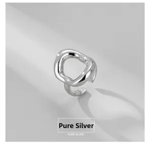 Macro shot of liquid metal style S925 sterling silver ring with organic hollow design
