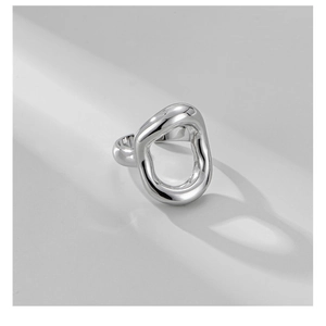 Detailed macro shot of an S925 sterling silver hollow geometric ring with metallic finish