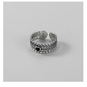 Macro detail of retro 925 sterling silver ring with black heart and S925 hallmark
