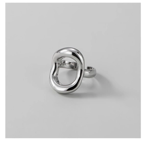 Macro shot of S925 sterling silver stamp on minimalist hollow oval ring band