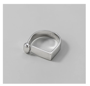 Macro detail of S925 sterling silver ring showing geometric lines and bead decoration