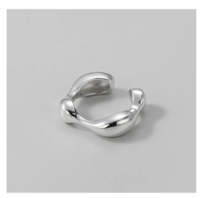 Detailed macro view of S925 sterling silver stamp on minimalist irregular fluid ring