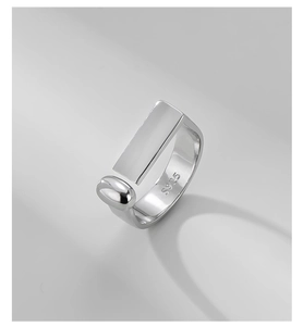Macro shot of 925 sterling silver ring showing geometric rectangle and polished finish