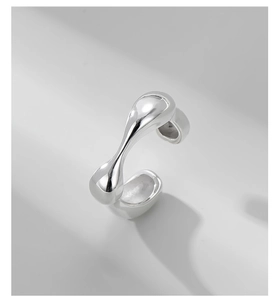 Detailed view of irregular fluid S925 sterling silver ring with polished liquid metal finish