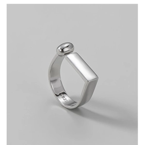 Macro shot of S925 sterling silver hallmark on minimalist geometric rectangular ring