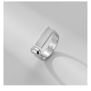 Macro detail of S925 sterling silver stamp on minimalist geometric open ring