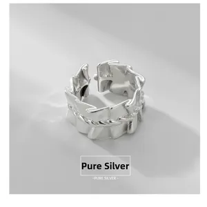 Macro shot of S925 sterling silver ring showing the 925 hallmark and pleated texture