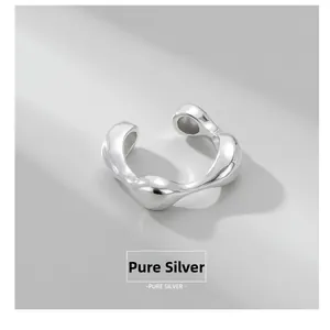 Macro shot of S925 sterling silver ring with irregular fluid liquid metal design