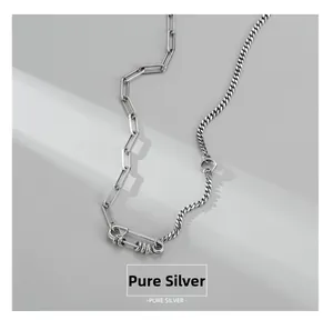 Detail of 925 sterling silver paperclip and curb chain necklace with industrial screw clasp