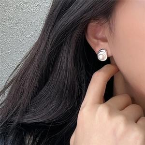 Minimalist S925 sterling silver pearl stud earrings with irregular wave liquid metal design
