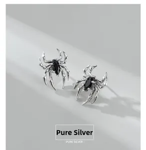 Detailed view of S925 sterling silver spider stud earrings with a black zircon stone
