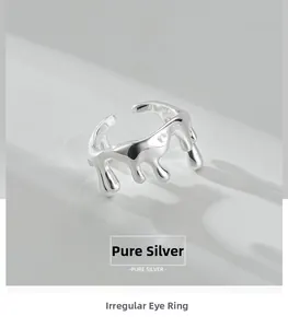 Macro detail of the irregular melt texture on a polished S925 sterling silver ring