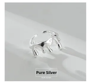 Macro shot of S925 sterling silver ring with liquid metal texture and S925 hallmark