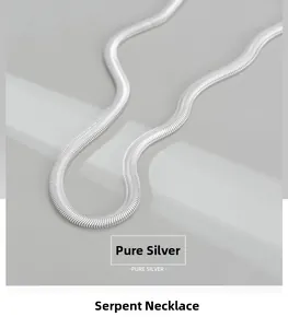 Macro shot of S925 sterling silver flat snake blade chain necklace showing fine metal texture