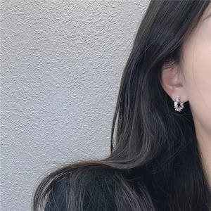 Modern S925 sterling silver hoop earrings with irregular crinkle texture on model