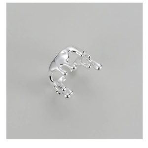 Macro shot of liquid metal S925 sterling silver ring with irregular lava texture