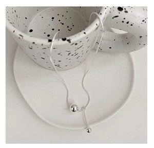 Detailed close-up of S925 sterling silver snake chain necklace with round bead pendant