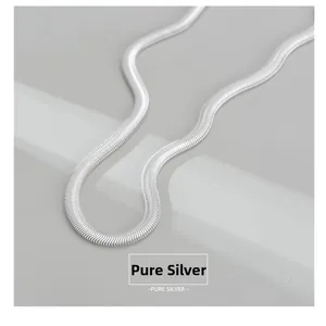 Macro detail of S925 sterling silver flat snake chain showing dense texture and metallic shine
