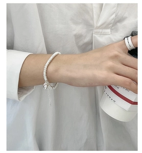 Detailed shot of S925 sterling silver heart bracelet with intricate ring chain design