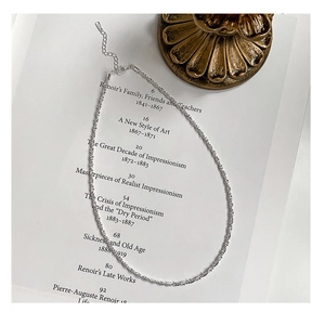 Detail of 925 sterling silver sparkling choker with adjustable lobster clasp on book page