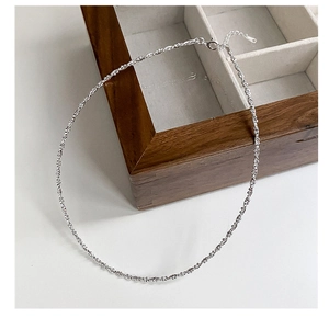 Detail view of shimmering 925 sterling silver choker chain with lobster clasp and extender