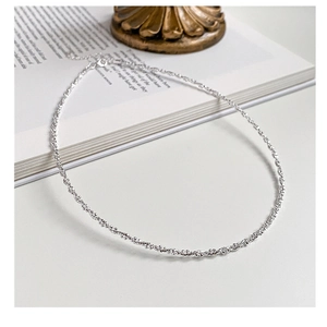 Close-up of 925 sterling silver choker featuring a shimmering texture and lobster clasp