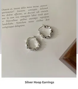Detail of s925 silver irregular crushed metal texture on hoop earrings for women