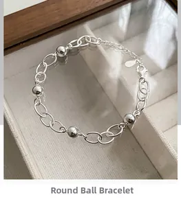 Detail of 925 sterling silver ball bracelet with oval chain and lobster clasp