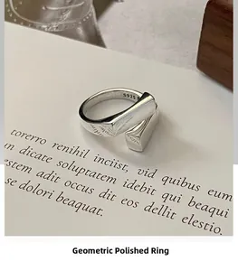 Detailed close-up of a S925 sterling silver geometric ring with polished finish