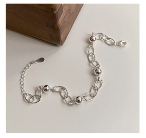 Detailed view of 925 sterling silver beaded bracelet with lobster clasp and extension chain
