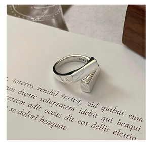 Detailed close-up of S925 sterling silver geometric interlocking square ring with stamp