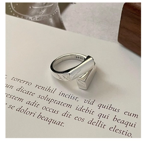 Close-up of S925 sterling silver geometric ring featuring a cross cube design and hallmark