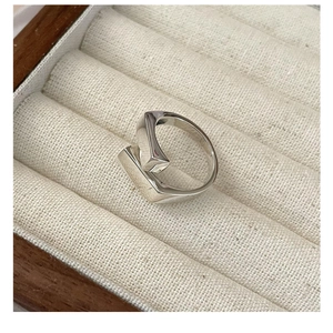 Macro shot of S925 sterling silver ring with geometric block and minimalist architecture design