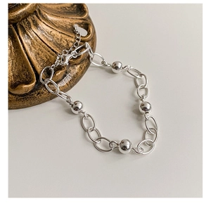 Detail of 925 silver beaded chain bracelet with lobster clasp and adjustable links