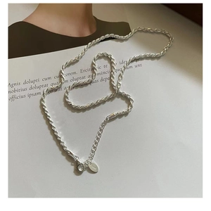 Detail of S925 sterling silver twisted cable chain with lobster clasp and logo tag