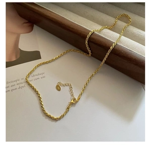 Detailed close-up of a 925 sterling silver gold-plated rope chain necklace showing texture