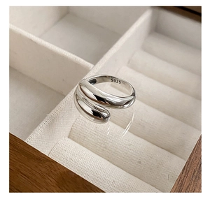 Macro shot of S925 sterling silver stamp on the inner band of polished double-wrap ring