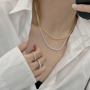 Minimalist S925 sterling silver rope chain necklaces and geometric rings on female model