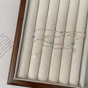 Elegant S925 sterling silver necklace with colorful beads on a beige velvet tray