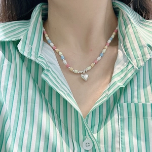 S925 sterling silver colorful beaded necklace with a polished heart pendant on a model