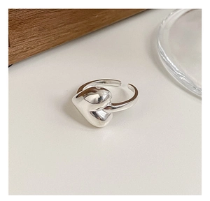 Macro shot of S925 sterling silver heart ring showing the inner band hallmark