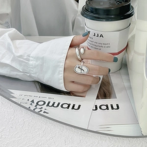 Minimalist S925 sterling silver rings set featuring twisted and oval lettered textures