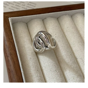 Detail of S925 sterling silver ring showing internal hallmark and woven texture