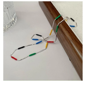 Detail of colorful enamel tube beads on S925 silver necklace with lobster clasp closure