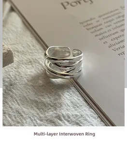 Close-up of S925 sterling silver multi-layer woven ring with fine texture