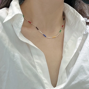 Minimalist S925 sterling silver rainbow necklace with colorful beads on a female model
