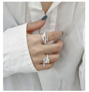 Close-up of S925 silver multi-layer woven ring and square zircon ring with chain