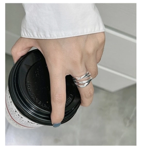 Close-up of S925 sterling silver woven multi-layer ring styled with a minimalist outfit