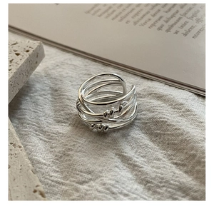 Macro shot of S925 sterling silver multilayer woven ring highlighting the metal hallmark