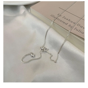 Detailed macro view of S925 sterling silver heart pendant with adjustable slider bead
